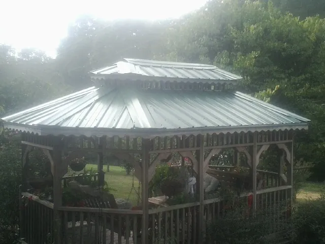 Two tier green metal roof on a garden gazebo in Williamsport